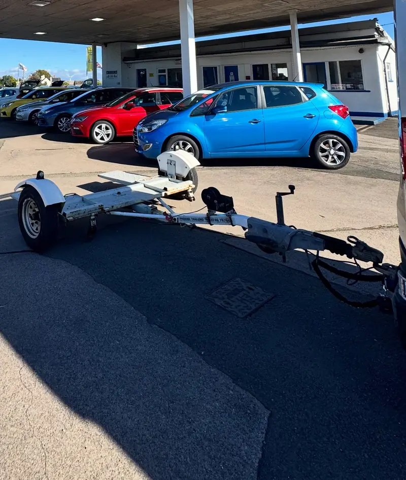 Tow dolly ready to collect a car